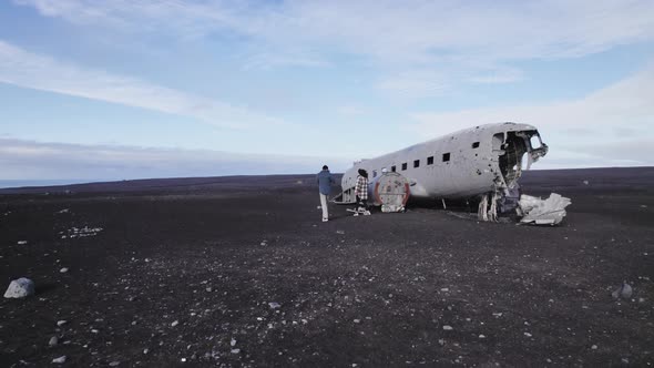 Travelers Walking Outside the Solheimasandur Plane Wreck