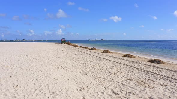 Scarbat Machine Assisted With People To Clean The Sargassum On The Crystalline Beach Of Punta Cana,