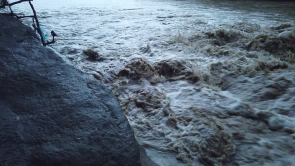 River flowing after heavy rain. Water stream After strong rain. Dirty and turbulent water after rain