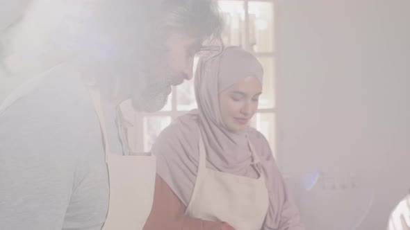 Diverse Man And Woman Cooking Together