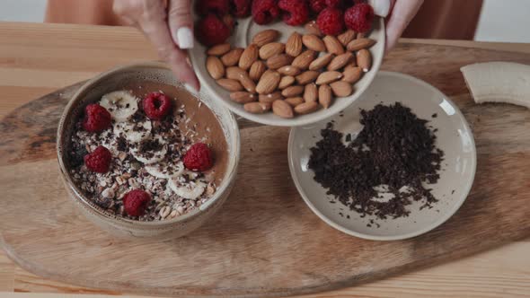 Top View of Woman Making Vegan Smoothie Bowl