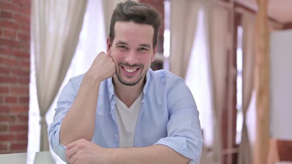 Cheerful Young Man Smiling at Camera