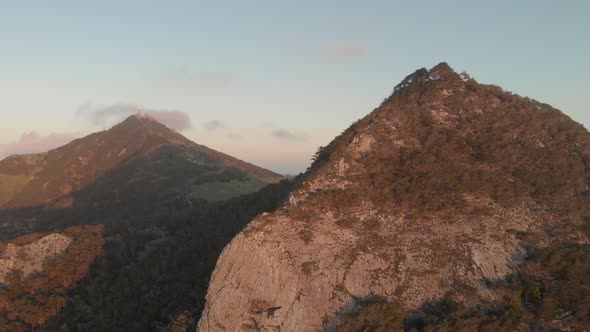 Aerial backward over mountains with Pico do Facho in background, Portugal