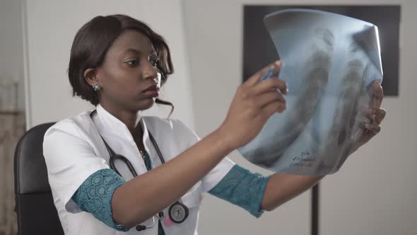 Beautiful African American Healthcare Worker with X-ray, Medical International Concept, Black Doctor