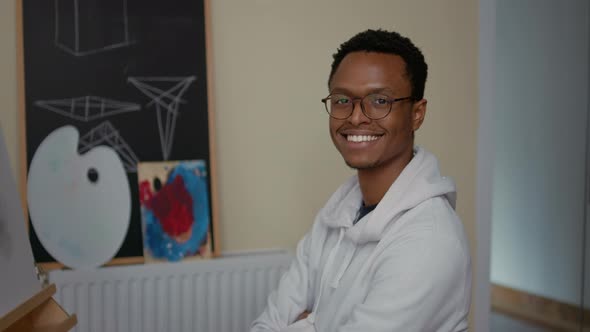 Portrait of Young Man Attending Art Class Lesson with Teacher