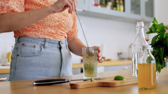 Woman Making Cocktail Drink at Home Kitchen