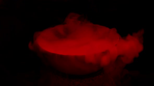 Red Smoking Magic Potion In The Dark