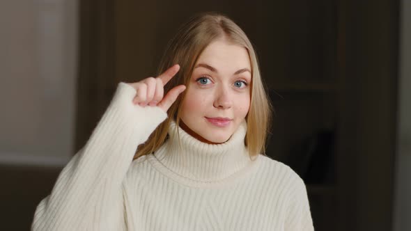 Young Blonde Model Caucasian Woman Confused Girl Standing Indoor Showing Very Tiny Shapes Small