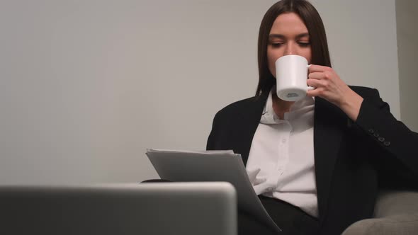 Caucasian Pretty Businesswoman Working with Papers Documents at Home or Office