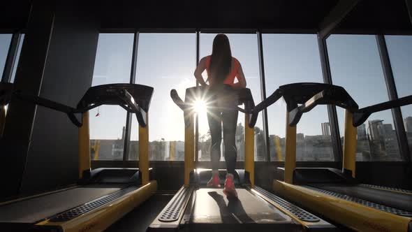 Girl Runs on a Treadmill