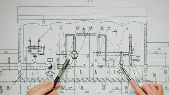 Architects Working with Plan Blueprint Closeup