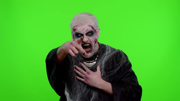 Halloween Zombie Man Pointing Finger to Camera Laughing Out Loud Taunting Making Fun Funny Joke
