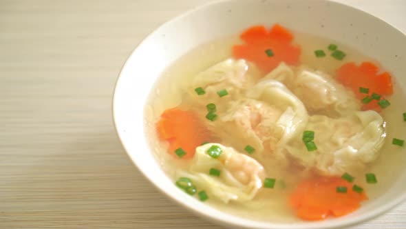 shrimp dumpling soup in white bowl - Asian food style