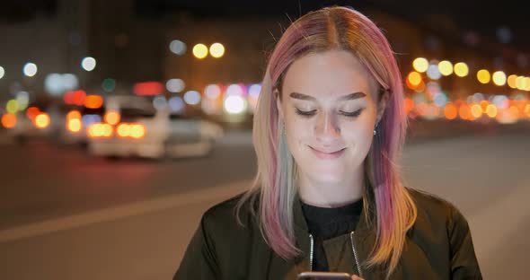 Blonde Model Holds Telephone in Hands Chats and Smiles