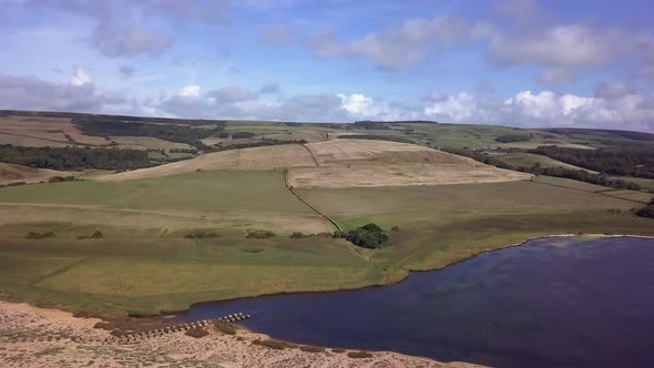 Extremely wide aerial shot centring on the Chapel of St Catherine's near the village of Abbotsbury,