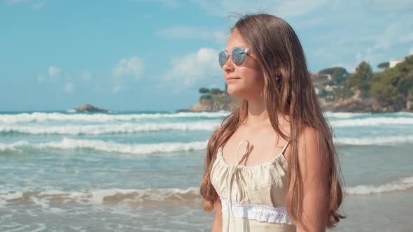 Carefree Girl Relaxing at Seaside