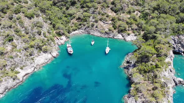 4k Aerial view of boats, Yacht in the bay sea in Fethiye Turkey, Summer vibes, Amazing turquoise sea