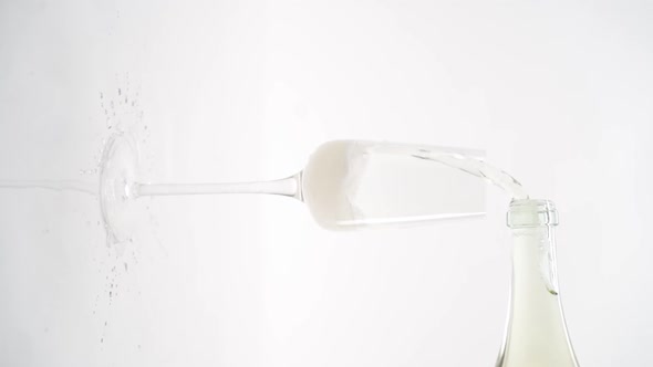 Vertical video, Close-up of sparkling champagne being poured into a glass; bubbles in a glass