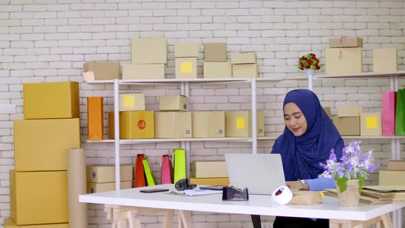 Young Muslim woman with start up small business entrepreneur freelance working at home