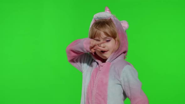 Little Blonde Child Girl Smiling Dancing Celebrating in Unicorn Pajamas Costume on Chroma Key