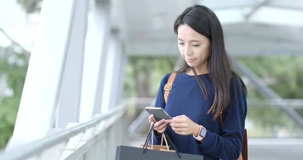 Woman use of cellphone at outdoor