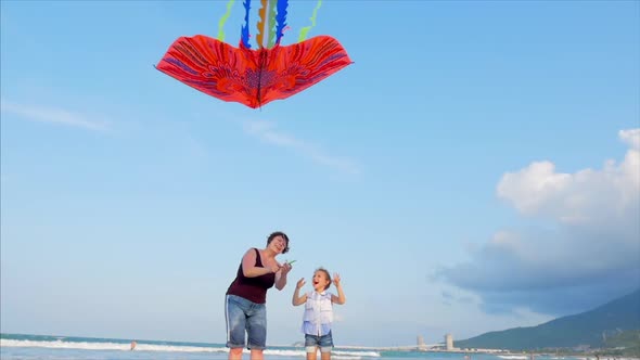 Happy Grandmother with Child the Playing Flying Kite