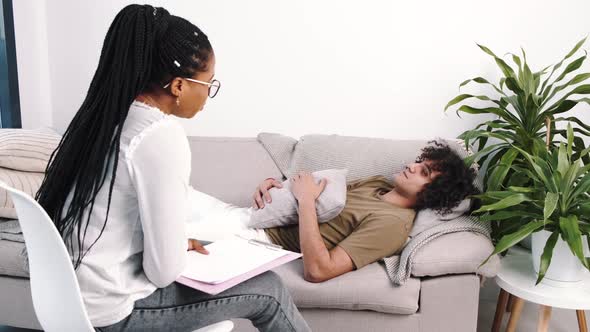 Man Talking to Lady Psychologist During Session