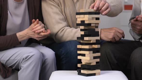 Senior Friends Having Fun in Nursing Home, Enjoying Games and Laughing, Joy