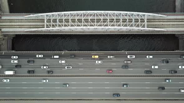 Aerial Top View on Highway and Bridge with Cars Traffic and Moving Train