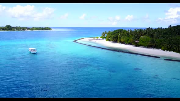 Aerial panorama of perfect resort beach adventure by blue lagoon with white sand background of a day