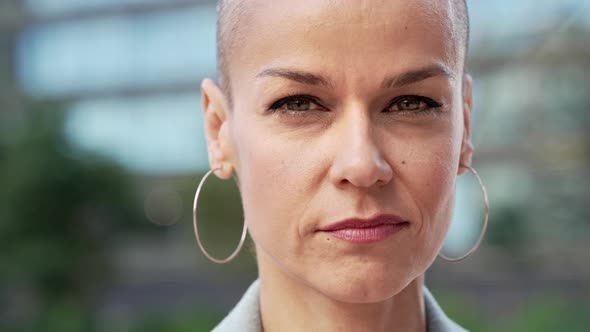 Close Up Portrait of Stylish Confident Woman with Shaved Hair