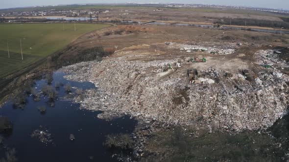 Aerial View on City Garbage Dump with Flocks of Birds