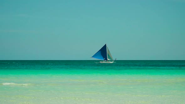 Sailing Boat in Blue Sea