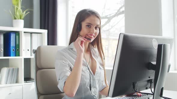 Young Woman Works at Home Office Using Computer.