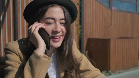 Adorable Woman Having Conversation Over the Phone.