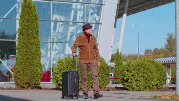 Senior Pensioner Tourist Grandfather Businessman Walking From Airport Hall Gate with Luggage Bag