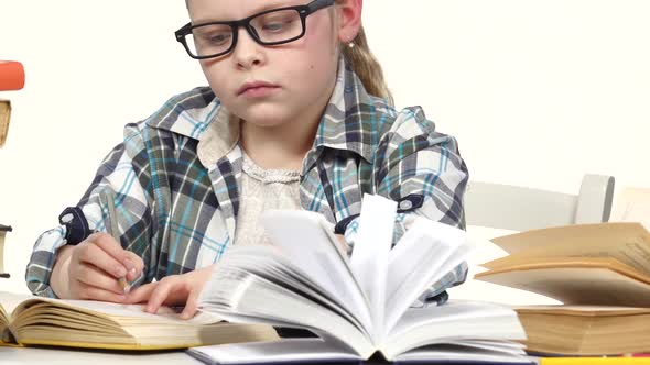 Girl Is Looking for Information and Records It. White Background. Close Up