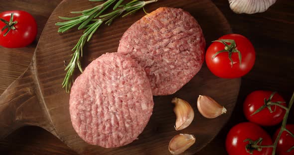 Raw Burger with Garlic, Rosemary and Tomatoes Rotates