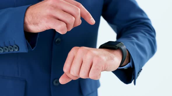 Mid section of businessman using smartwatch 4k