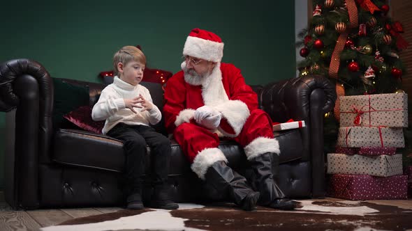 Cute Little Boy Tells Santa Claus About His Dreams and Receives Cherished Gift