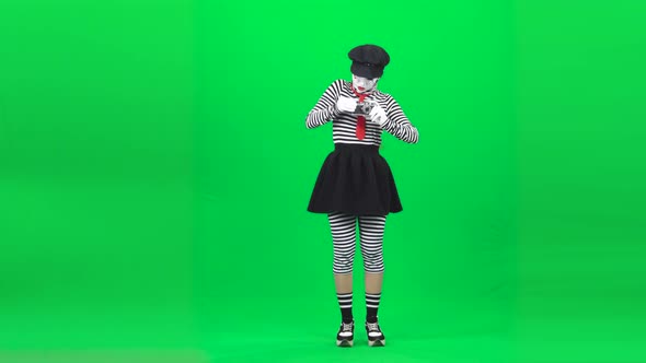 Mime Female Acting Like She Photographer. Chroma Key. Full Length.