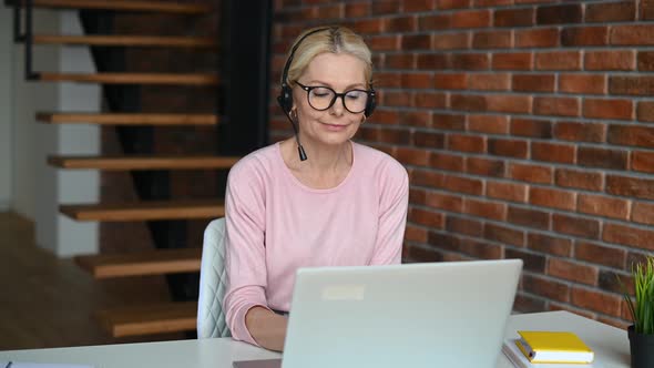 A Middleaged Woman in the Home Office