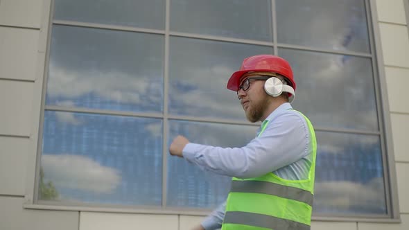 a Worker Dances at a Construction Site