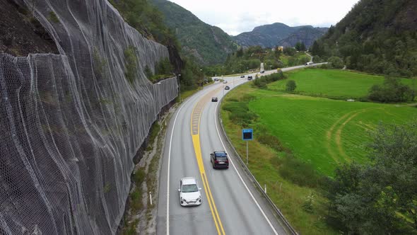 Road E16 leading to Voss and Oslo from Bergen Norway - Ice and landslide prevention net on cliff to
