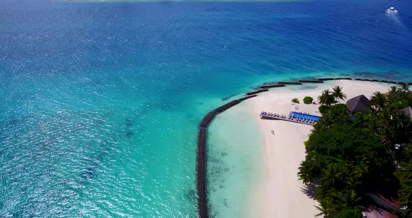 Tropical above abstract view of a white sand paradise beach and aqua blue ocean background in high r