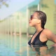 Young asian woman enjoy around outdoor swimming pool for leisure - VideoHive Item for Sale