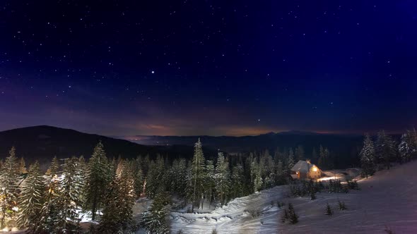 Stars Moving Above Small House In The Mountains In WInter. Ukraine, Carpathian