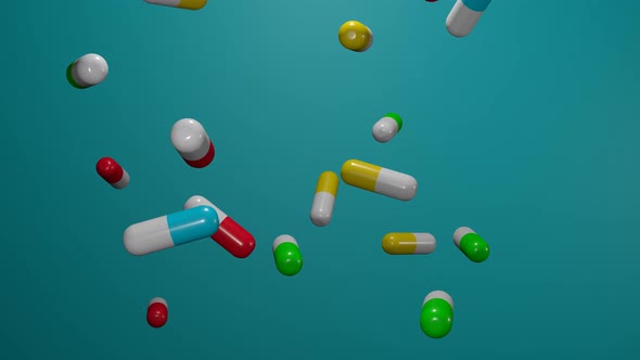 Many pills falling down on blue background.