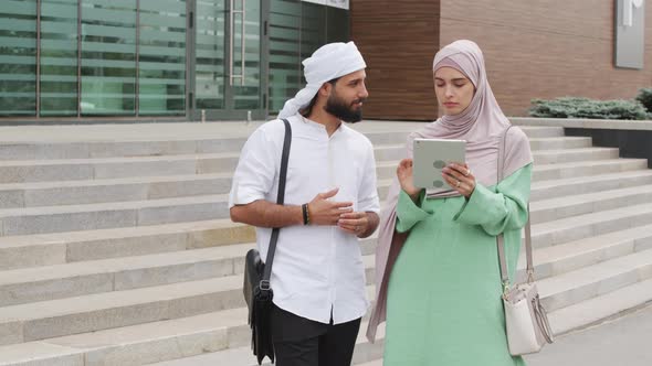 Muslim Couple Using Tablet Computer