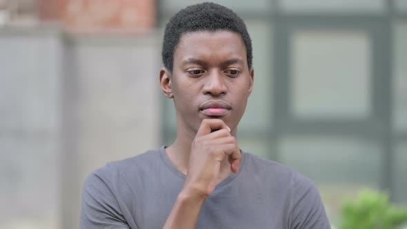 Portrait of Thoughtful Young Young African Man Thinking